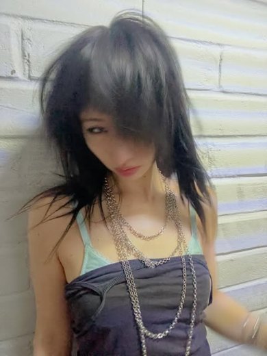 Model wearing stacked silver chain necklaces by Baby Toefu