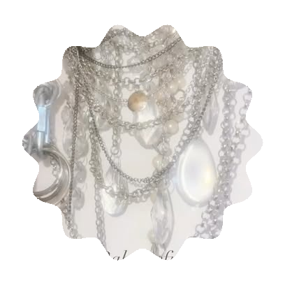 Silver chains, pearls and crystal charms flat-lay